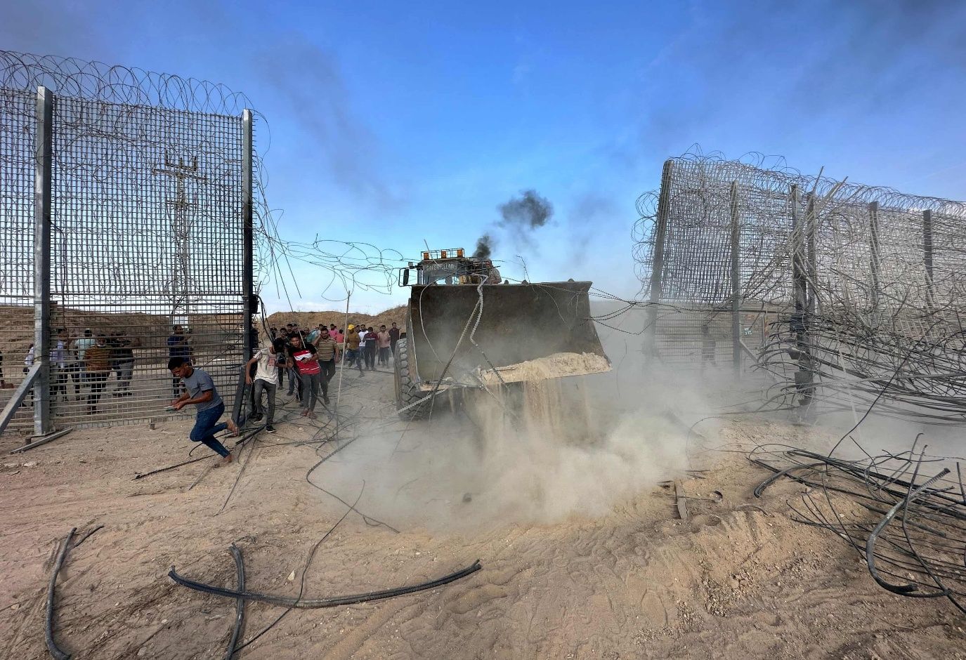 Palestinians breach the Israeli security fence at Khan Yunis, 7 October 2023