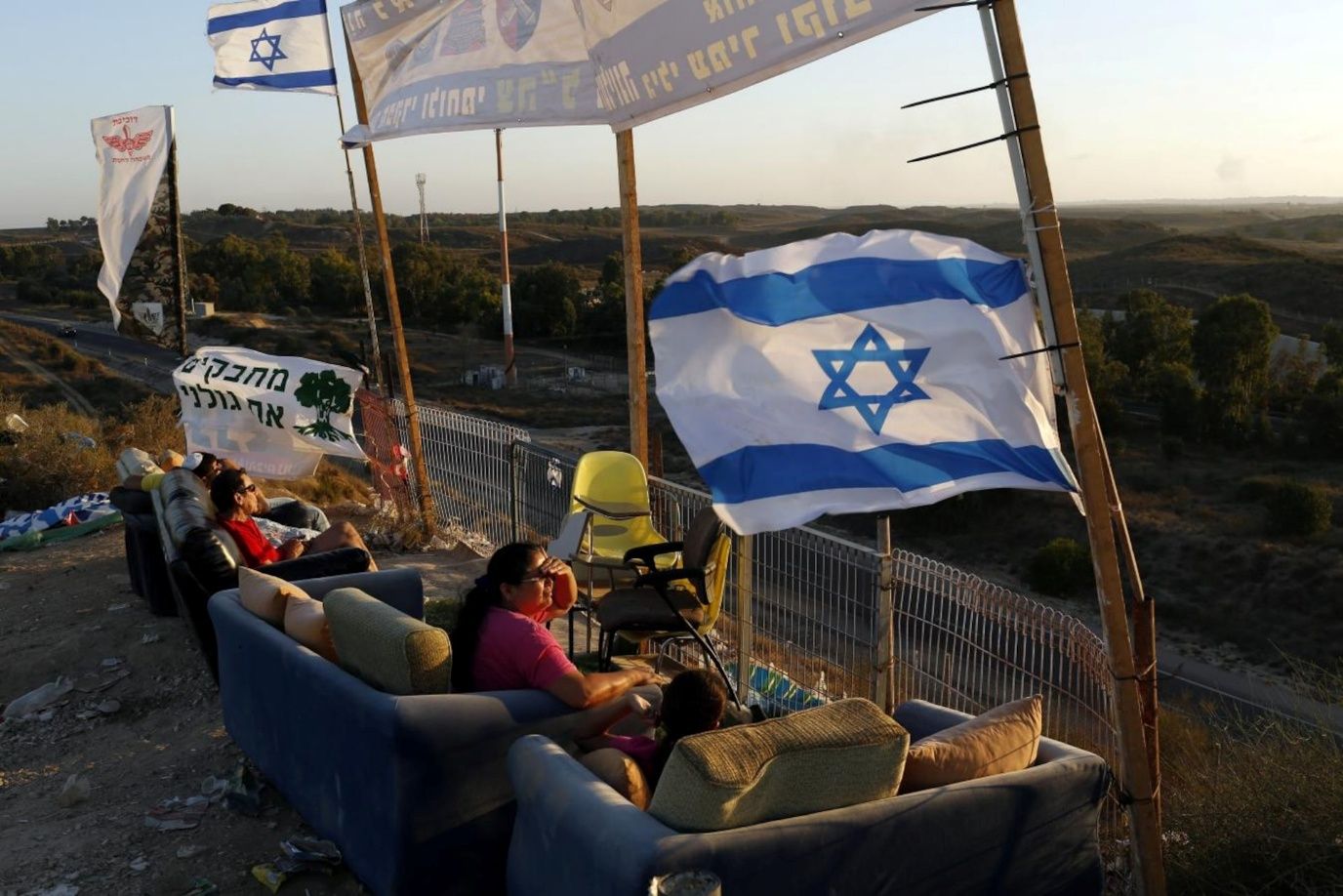 Israelis gathered on the borders to spectate and took to social media to celebrate war crimes against Palestinian civilians – ‘there are no innocents 